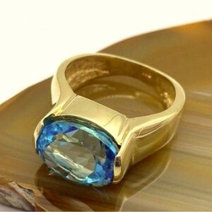 14K solid gold Swiss blue topaz ring.